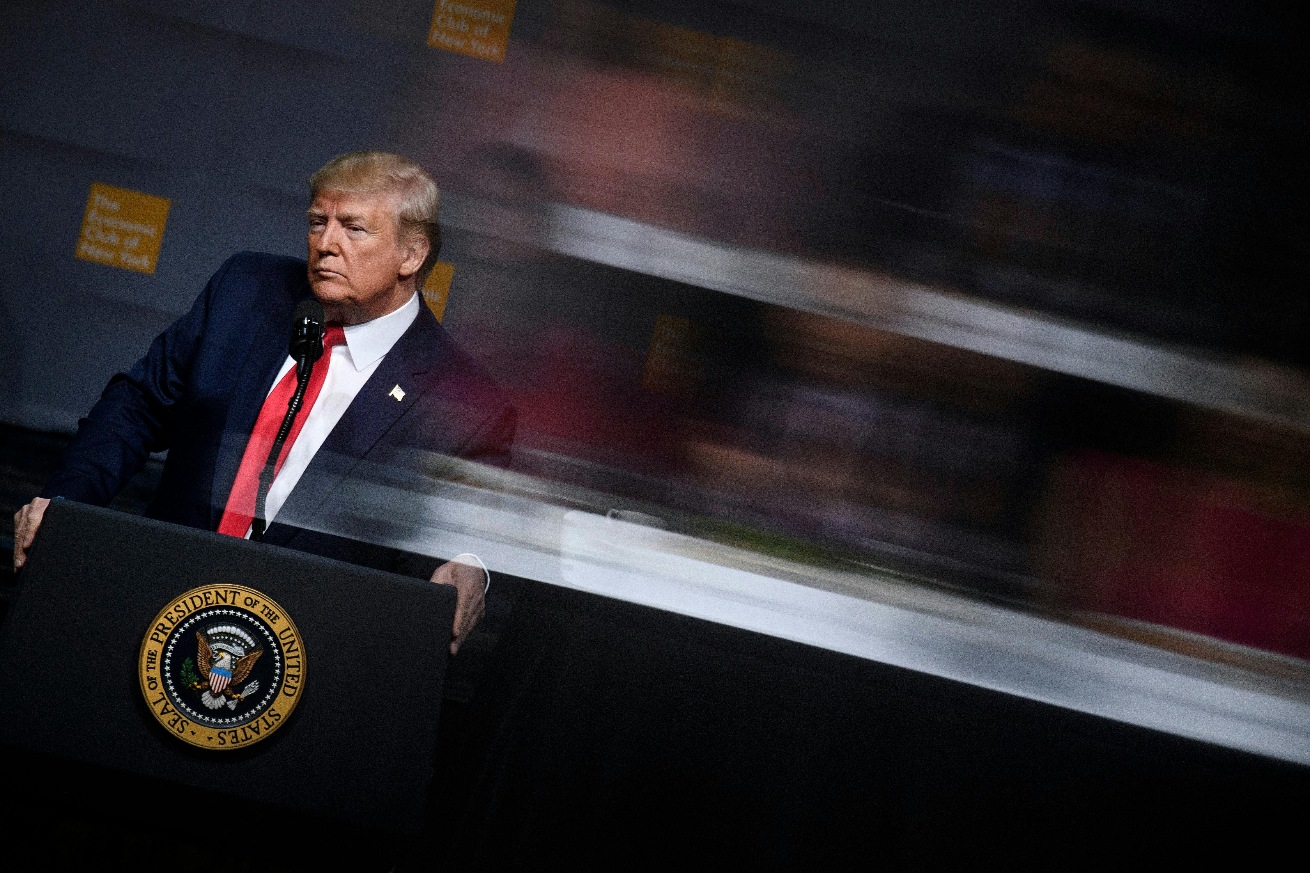 Donald Trump pauses while speaking at the Economic Club of New York.