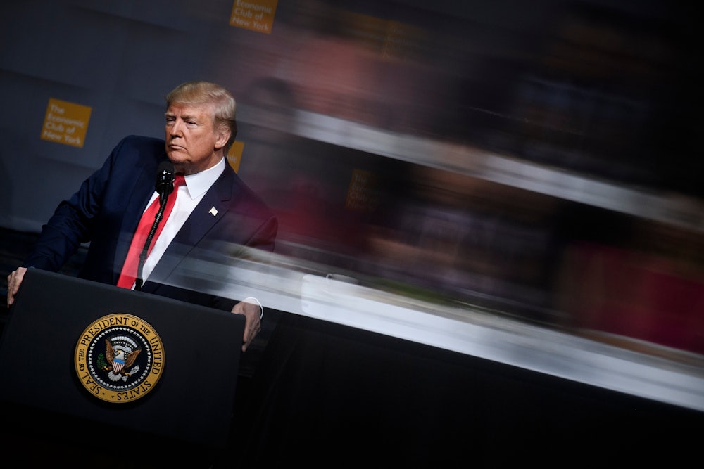 Donald Trump pauses while speaking at the Economic Club of New York.