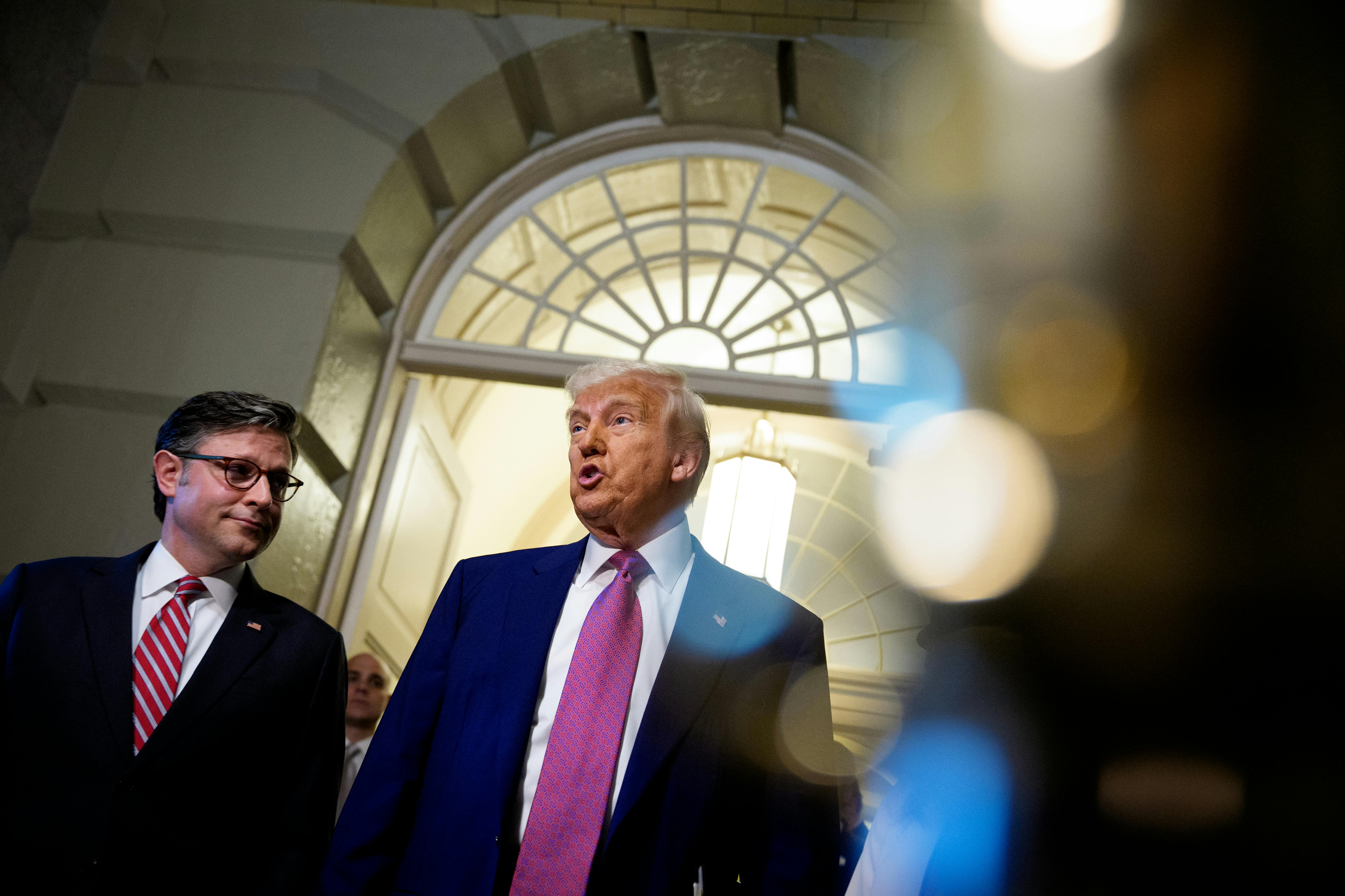 President Donald Trump, accompanied by Speaker of the House Mike Johnson.