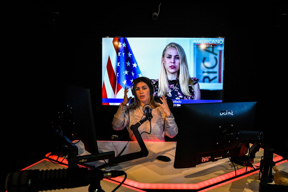 Host of conservative Spanish-language media network Americano Media Group Dianelys Guerra works in her studio in Miami, Florida.