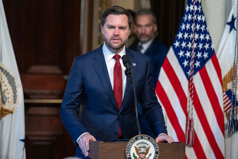 JD Vance speaks at a podium