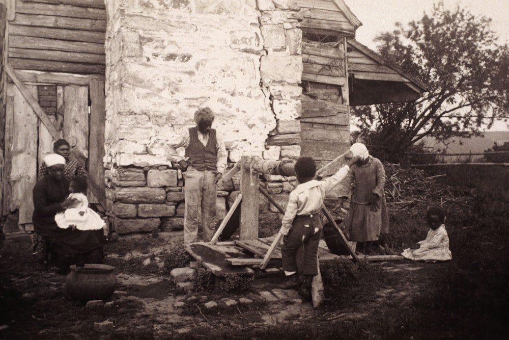 A family of formerly enslaved people outside their house in Fredericksburg, Virginia, circa 1862-1865.
