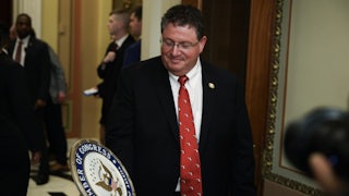 Representative Randy Fine holds a congressional seal while in the Capitol.