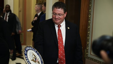 Representative Randy Fine holds a congressional seal while in the Capitol.
