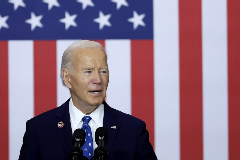 Joe Biden in front of a large U.S. flag