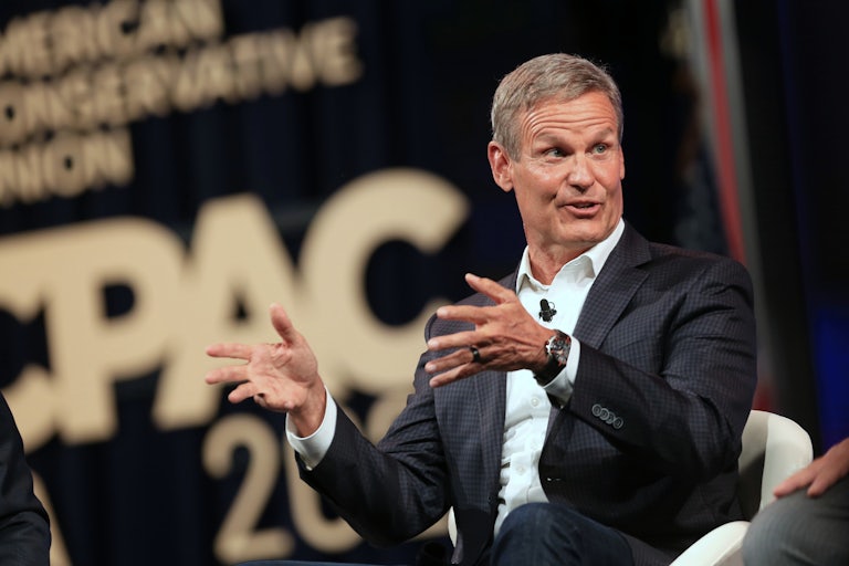 Tennessee Governor Bill Lee speaks while seated
