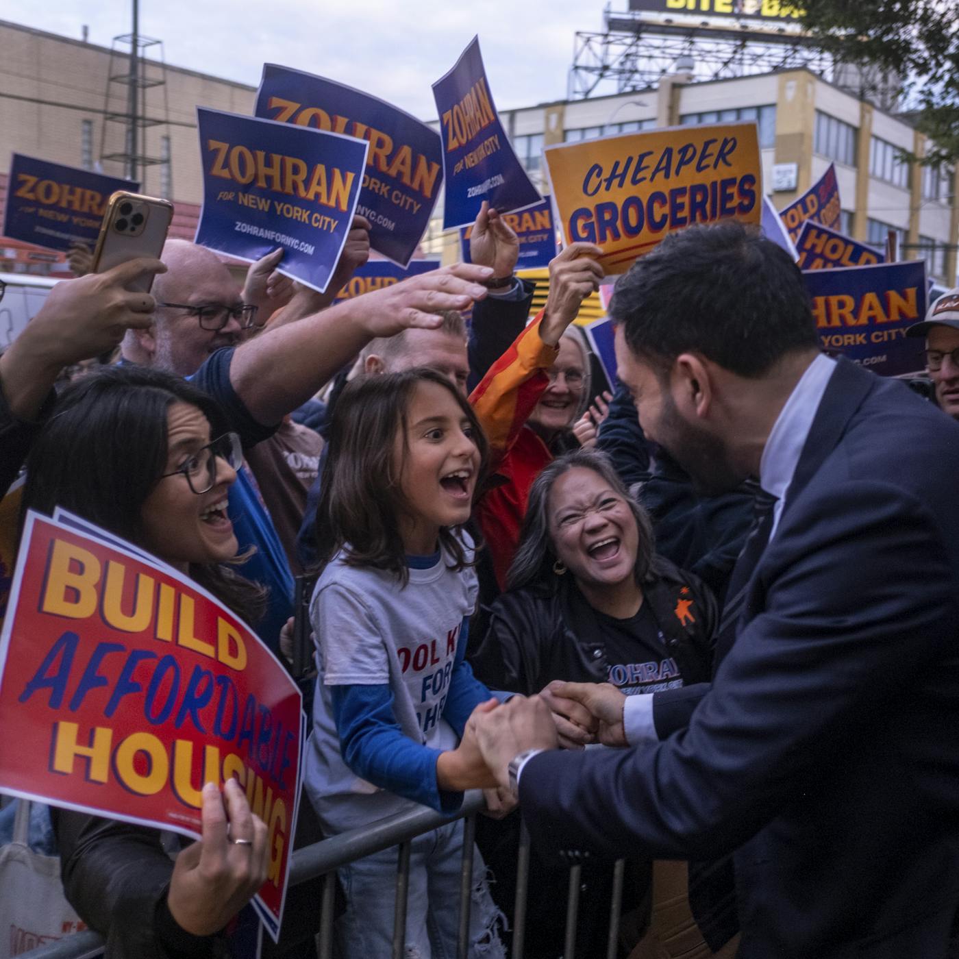 Mamdani greets supporters outside the LaGuardia Performing Arts Center as he arrives for the final mayoral debate