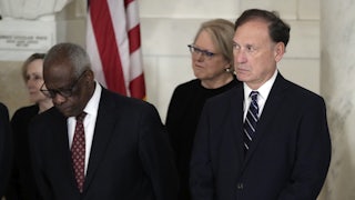 Justices Alito and Thomas stand, side by side.