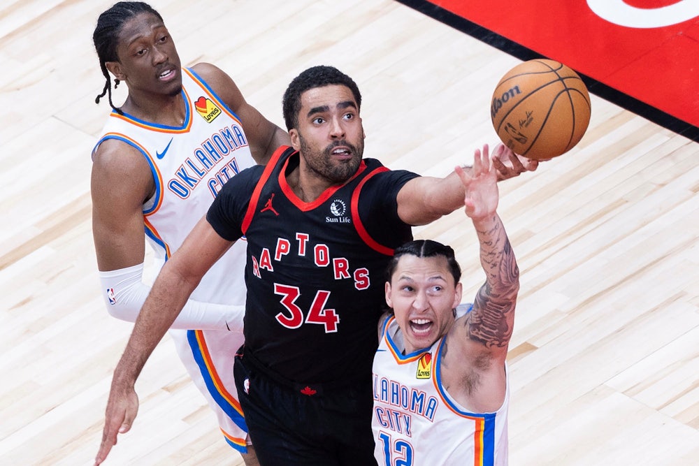 Jontay Porter of the Toronto Raptors fights for a rebound during a match with the Oklahoma City Thunder in Toronto, Canada.