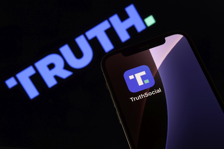 A phone screen displays the Truth Social app