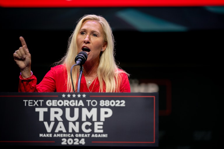 Marjorie Taylor Greene gestures while speaking at a Donald Trump campaign event