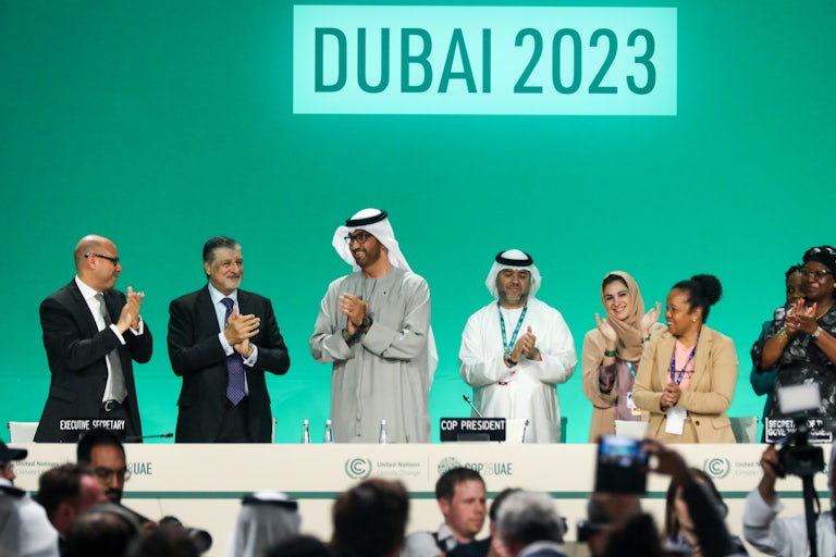 Delegates applaud after a speech by Sultan Ahmed Al Jaber, president of COP28