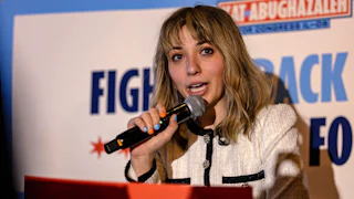 A photograph of Kat Abughazaleh speaking to supporters in Chicago after her loss in the Illinois Democratic primary election on Tuesday