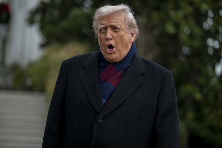 Donald Trump speaks while standing outside the White House