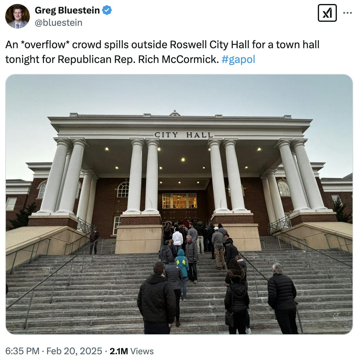 X screenshot Greg Bluestein @bluestein: An *overflow* crowd spills outside Roswell City Hall for a town hall tonight for Republican Rep. Rich McCormick. #gapol (photo of people all the way down the City Hall steps)