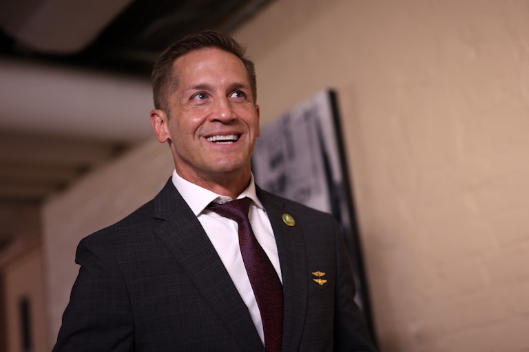 Representative Rich McCormick smiles while walking in the U.S. Capitol