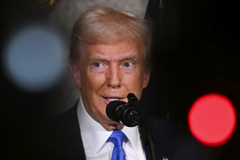 Donald Trump speaks to reporters during a press conference at Mar-a-Lago