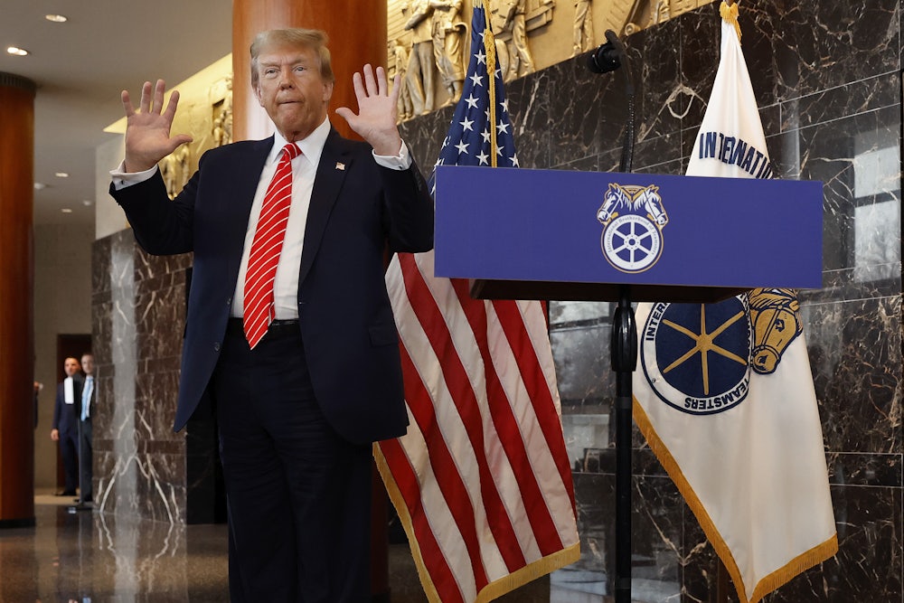Donald Trump holds up his hands after being asked about them by reporters at the International Brotherhood of Teamsters headquarters on January 31, 2024 in Washington, DC.