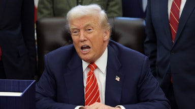 Donald Trump speaks while sitting at this desk in the Oval Office