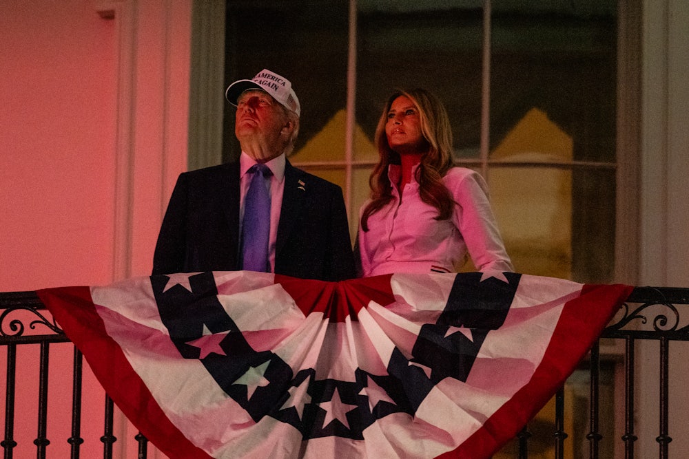 Donald Trump and First Lady Melania Trump watch fireworks during a Fourth of July celebration at the White House.