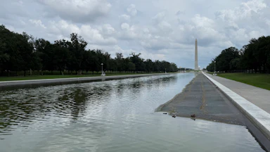 The Lincoln Memorial Reflecting Pool on July 13, partially drained, showing what appear to be tire marks at the bottom