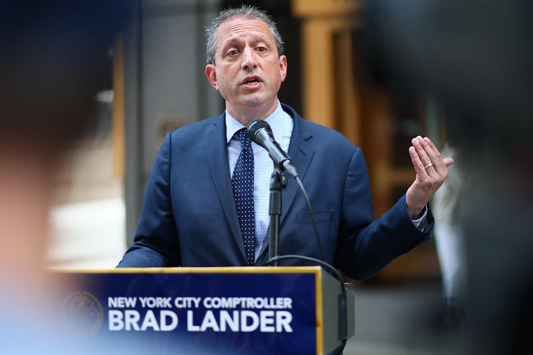 Brad Lander speaks behind a lectern