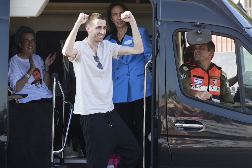 Released Israeli hostage Avinatan Or greets well-wishers upon arriving at Beilinson Hospital in the Rabin Medical Centre in Petah Tikva in central Israel on October 13, 2025. Israel said that the last 20 living hostages released by Hamas on October 13, had arrived in the country.