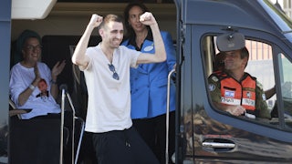 Released Israeli hostage Avinatan Or greets well-wishers upon arriving at Beilinson Hospital in the Rabin Medical Centre in Petah Tikva in central Israel on October 13, 2025. Israel said that the last 20 living hostages released by Hamas on October 13, had arrived in the country.