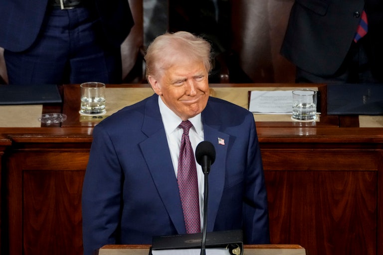 Donald Trump smiles during his speech to a joint session of Congress
