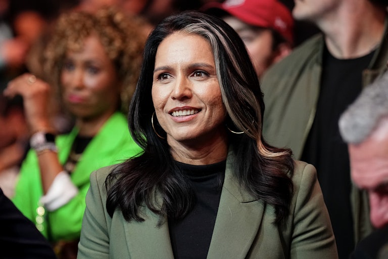 Tulsi Gabbard smiles while attending a UFC match
