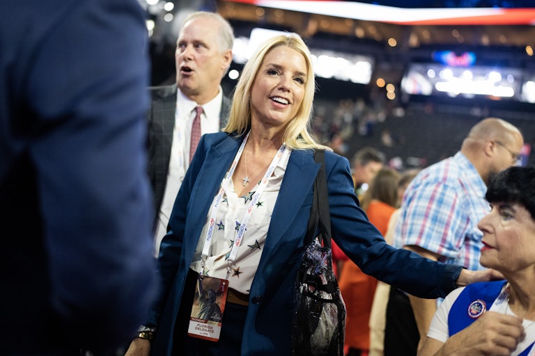 Pam Bondi smiles and walks at the Republican National Convention