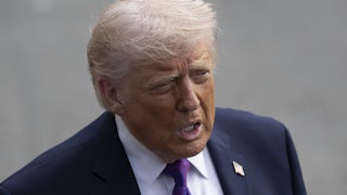 Donald Trump speaks to reporters outside the White House