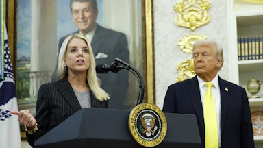 Attorney General Pam Bondi speaks at a lectern in the Oval Office of the White House, while President Trump looks on.