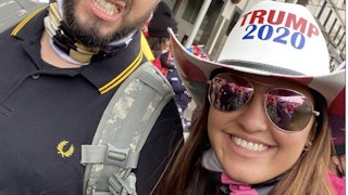 Barbara Balmaseda smiles with sunglasses and a Trump 2020 hat. A man beside her grimaces.