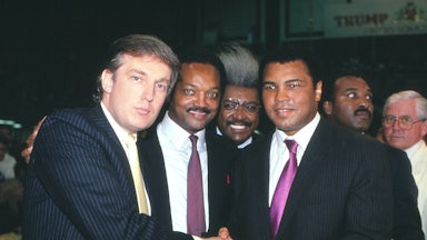 Donald Trump, Jesse Jackson, Don King, and Muhammad Ali smile in a black and white photo.