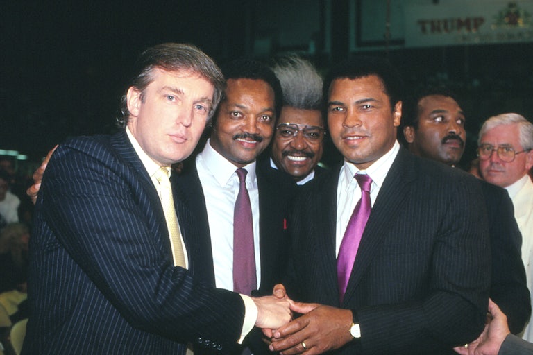 Donald Trump, Jesse Jackson, Don King, and Muhammad Ali smile in a black and white photo.