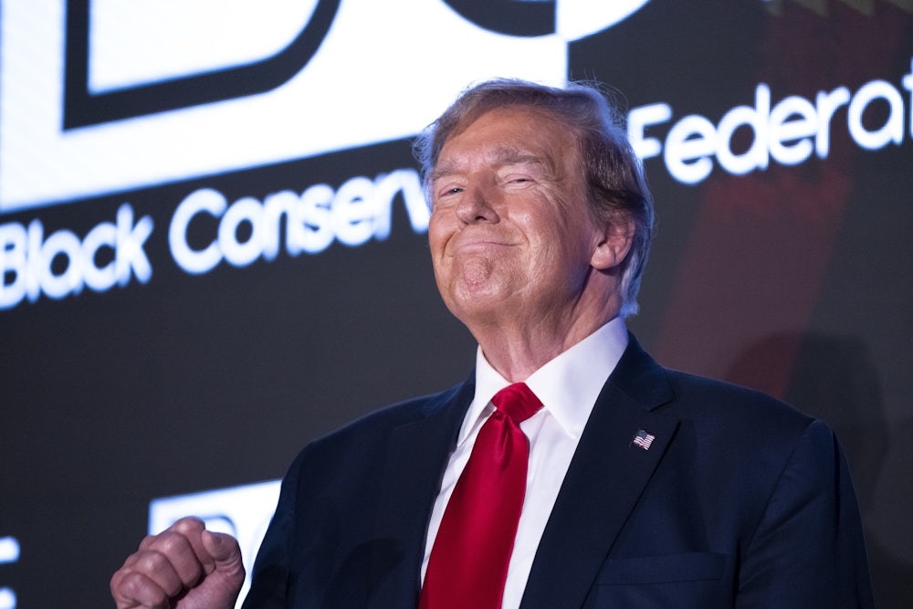 Donald Trump raises his fist during the Black Conservative Federation Gala in Columbia, South Carolina.
