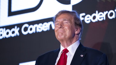 Donald Trump raises his fist during the Black Conservative Federation Gala in Columbia, South Carolina.