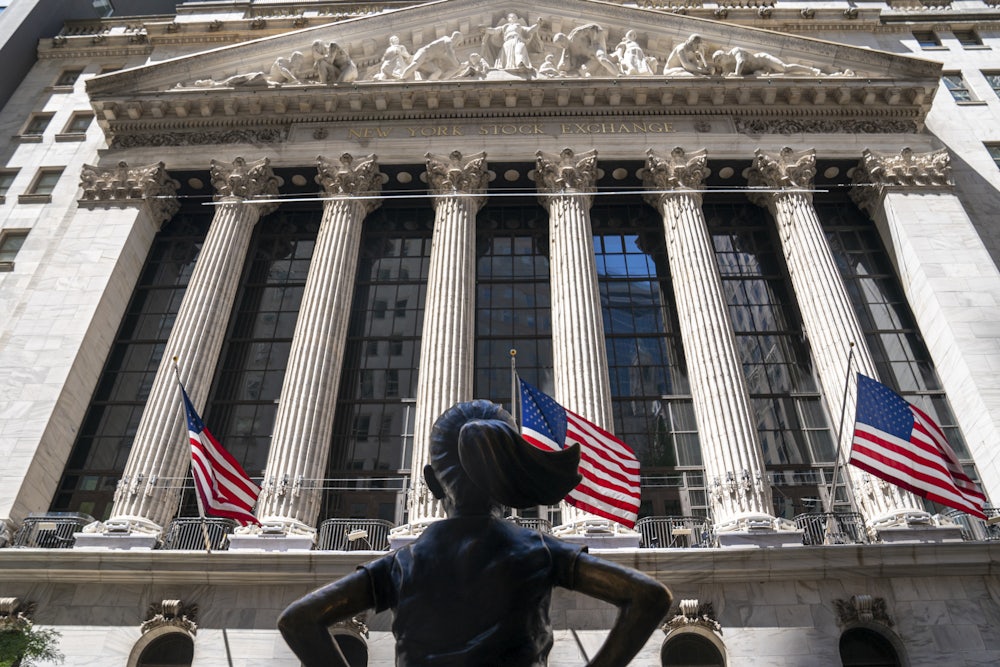 The Fearless Girl bronze sculpture faces the New York Stock Exchange building