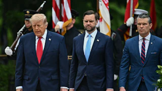 President Donald Trump, Vice President JD Vance, and Defense Secretary Pete Hegseth stand side by side, looking down.