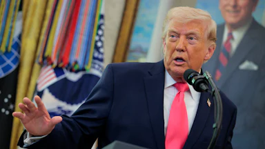 President Donald Trump speaks at the presidential podium in the West Wing of the White House.