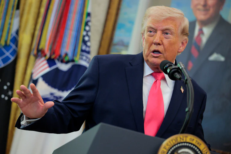 President Donald Trump speaks at the presidential podium in the West Wing of the White House.
