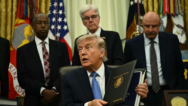 Donald Trump presents findings of his Religious Liberty Commission in the Oval Office of the White House.