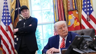 Donald Trump sits at his desk in the Oval Office, while Elon Musk stands behind him with his arms crossed