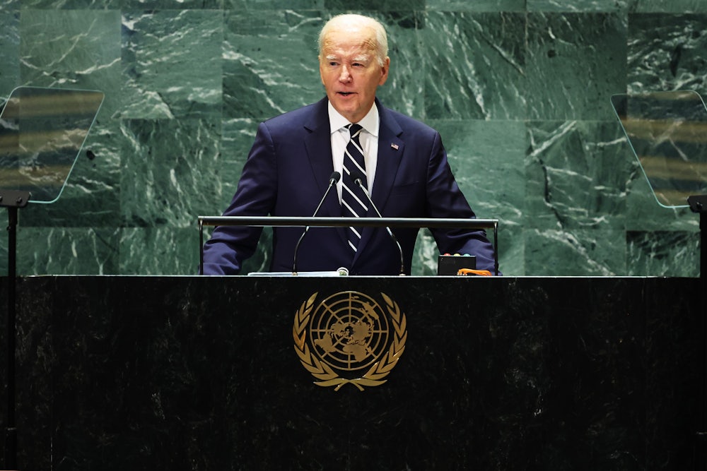 President Joe Biden stands at a lectern bearing the United Nations logo.