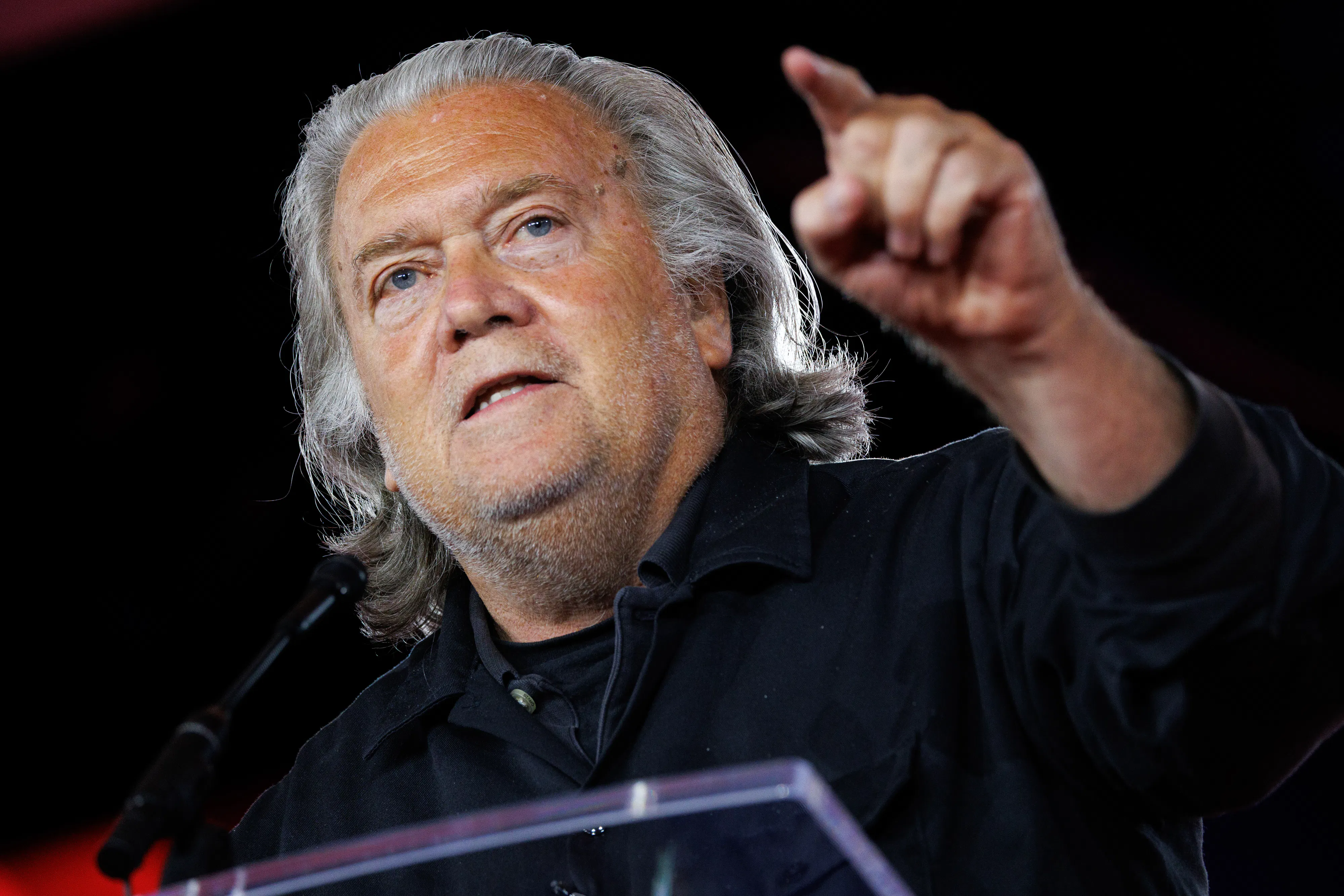 Steve Bannon points while speaking at CPAC