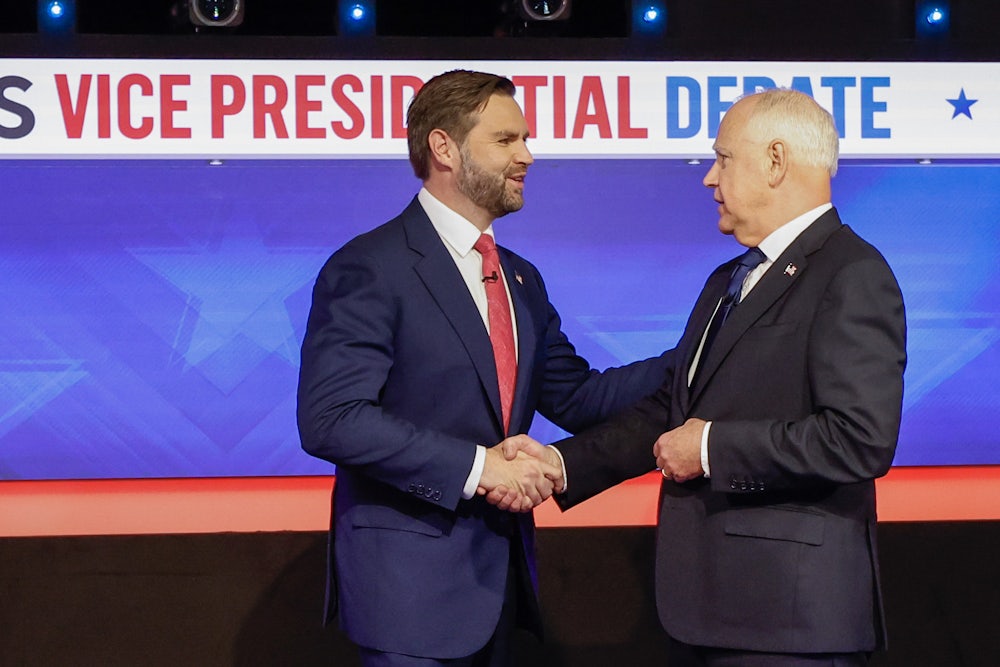 Governor Tim Walz and Senator JD Vance shake hands after the vice presidential debate