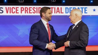 Governor Tim Walz and Senator JD Vance shake hands after the vice presidential debate