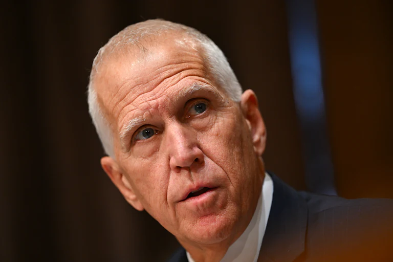 Senator Thom Tillis looks to the side while speaking during a Senate committee hearing