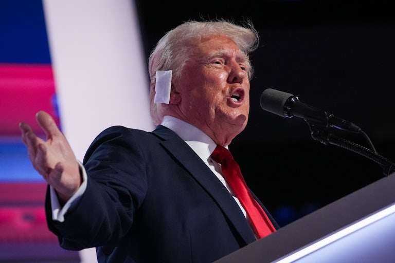 Donald Trump speaks yells into a mic